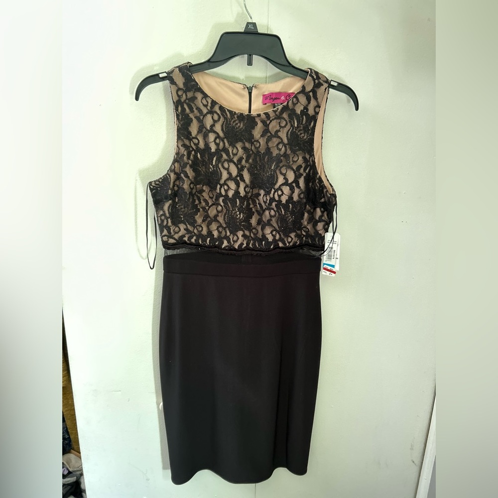 Size 9/10 Women’s / Juniors black cocktail dress with lace. New with tags.